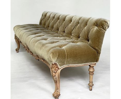 HALL SOFA BANQUETTE, 19th century French walnut with deep buttoned heather green velvet upholstery and carved front supports,