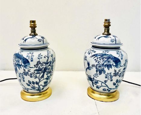 TABLE LAMPS, a pair, Chinese style blue and white ceramic on gilt bases, 34cm H x 20c m W x 20cm D. (2)