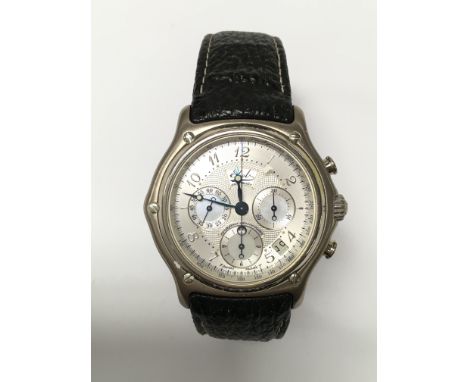 A gents boxed Ebel automatic chronometer wristwatch, with skeleton back. The back also marked 750. The metallic dial presents