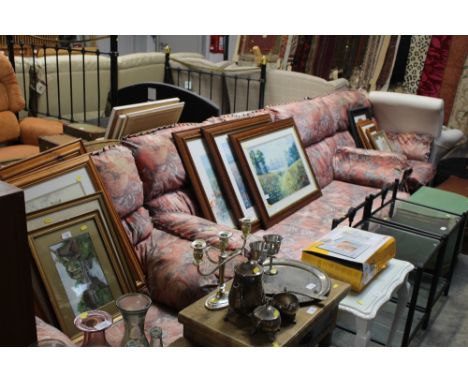 A floral upholstered three piece suite comprising of a three seater settee and two matching armchairs 