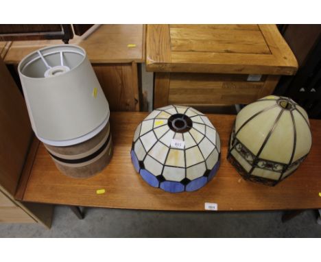 Three Tiffany style light shades and a quantity of lamp shades