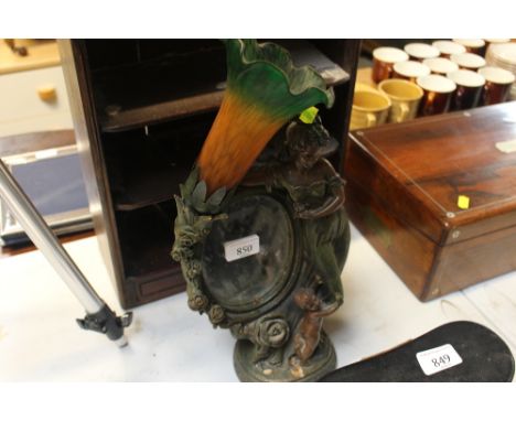 A figural table lamp