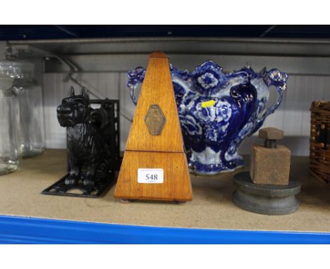 A French metronome; together with a pair of book ends in the form of a Yorkshire terrier
