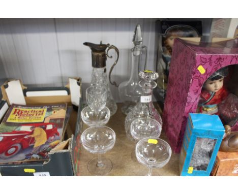 A cut glass decanter and stopper; a claret jug; champagne saucers etc