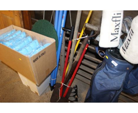 A quantity of long handled garden tools 
