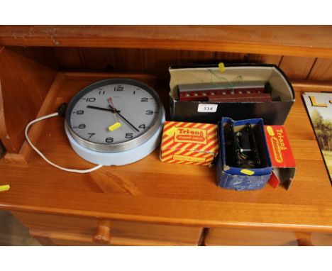 A small quantity of model railway; together with an electric wall clock