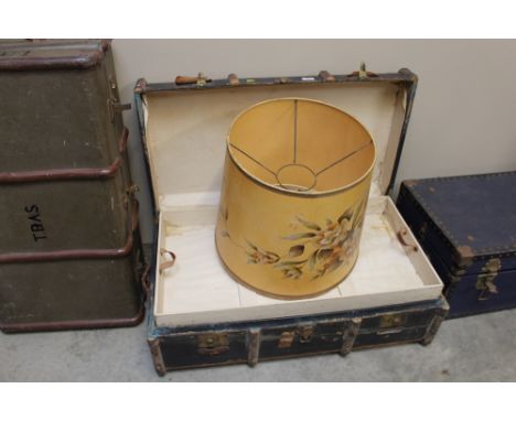 A wooden bound travelling trunk; together with a lamp shade