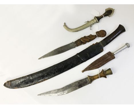 GROUP OF AFRICAN DAGGERS AND KNIVESINCLUDING WEST CENTRAL AFRICAN DAGGER, AFRICAN CURRED 27" KNIFEMOROCCAN DAGGER
