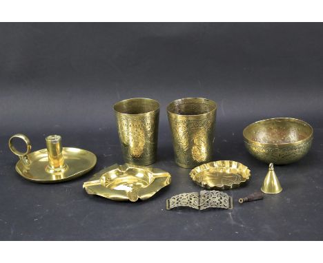 A selection of brassware. To include two highly embossed and engraved beakers, possibly Indian, a similar bowl, a chamber sti