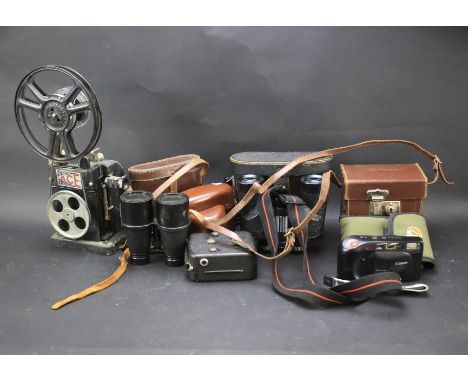 An assortment of vintage binoculars and cameras. To include a Agfa Compur Rapid film camera, W O model binoculars and a pair 