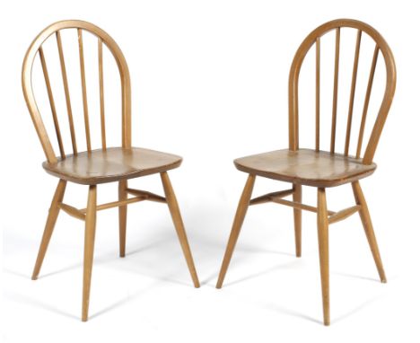 A pair of Windsor elm and beech spindle back dining chairs. Perhaps Ercol, with arched spindle back, on turned supports, with