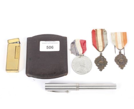 An assortment of collectables. Including a Dunhill lighter, Sheaffer pen, commemorative medals, etc