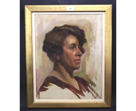 A 20th century oil on canvas depicting a portrait of a woman. Unsigned, label to verso attributing the work to Arthur Spooner
