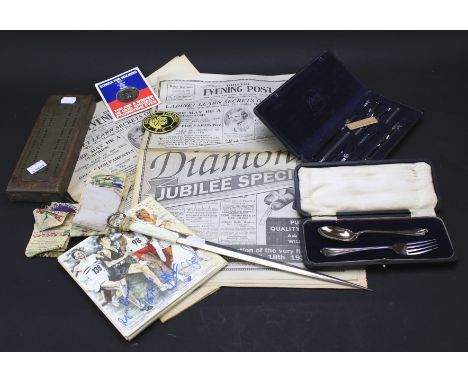 An assortment of mixed collectables. Including cribbage board, a Sheffield silver cased spoon and fork set , geometry set, Co