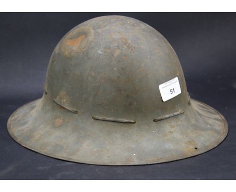 An English WWII British Civil Defence ARP steel helmet. With the original liner, chin strap present. 