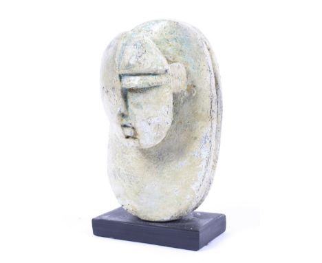 Peter Hayes (1946), abstract sculpture. Raised on a rectangular slate base, incised signature to one edge of base, H19cm.