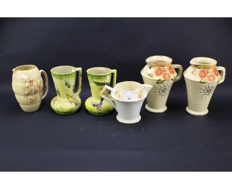 Six ceramic jugs. Comprising a Myott example. a pair by Arthur Wood decorated with flowers and one other and a pair by Tudor 