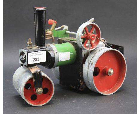 A Mamod steam roller. In green with red wheels, L26cm