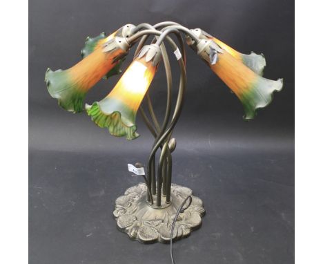 A 20th century Tiffany style table lamp. In the form of five flowers, with coloured glass shades, H44cm 