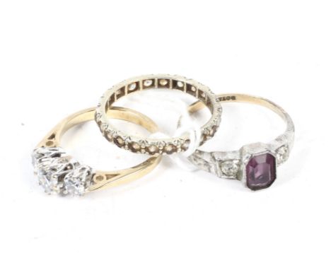 Two 9ct gold rings and a yellow metal full eternity ring.Comprising: an Art Deco amethyst and white stone set 9ct gold and si