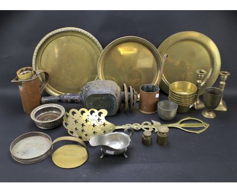 An assortment of metalware. Including candlesticks, a coaching lamp, two trays etc