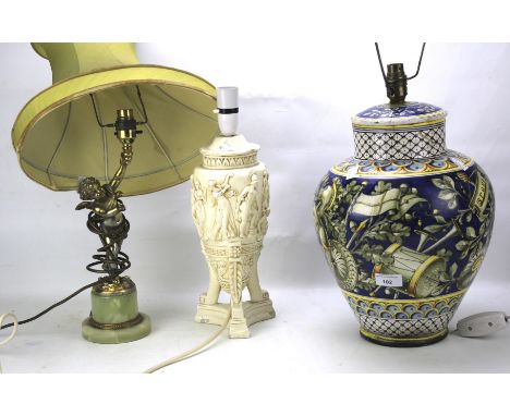 Three contemporary lamp bases. Comprising a ceramic example with painted decoration, one featuring a metal cherub and the thi