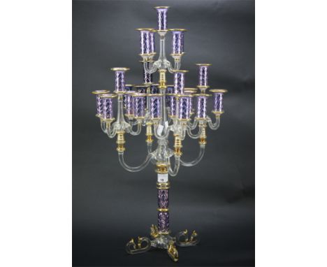 A contemporary glass candlestick. With five branches, each supporting five arms, in blue and purple with gilt details, H61cm