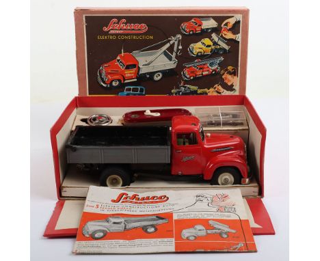 Schuco 6065 Elektro Construction Tipping Lorry, red tinplate cab, plastic rear tipper, model is in good condition, some paint