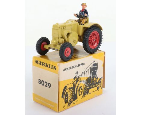 Marklin (Western Germany) 8029 Lanz Bulldog Tractor, mustard yellow body, red wheel hubs, with driver, in near mint original 