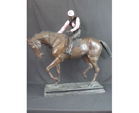 AFTER BONHEUR, A PATINATED BRONZE STUDY OF MOUNTED JOCKEY WITH ENAMEL COLOURED SILKS ON RECTANGULAR SHAPED, SWEPT BASE.  36" 