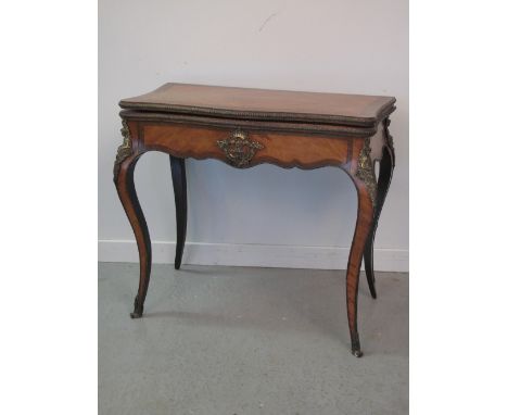 19th CENTURY FRENCH WALNUT FOLD OVER SERPENTINE CARD TABLE, the top with quarter veneers and broad banding opening to reveal 