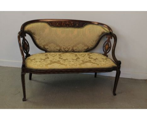 EARLY 20TH CENTURY INLAID MAHOGANY UPHOLSTERED SOFA, having pierced splats and swept arms with padded seat and back raised on