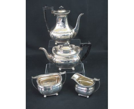 EDWARD VII FOUR PIECE SILVER TEA AND COFFEE SET comprising teapot, coffee pot, cream jug and two handled sucrier, all raised 