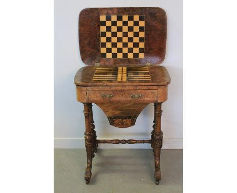 VICTORIAN INLAID WALNUT GAMES AND WORK TABLE having foliate inlaid and strung top opening to reveal chequer board and backgam