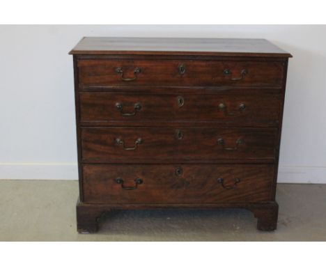 18th CENTURY MAHOGANY STRAIGHT FRONTED CHEST OF FOUR GRADUATED AND COCK BEADED DRAWERS under a moulded edged top, all with br