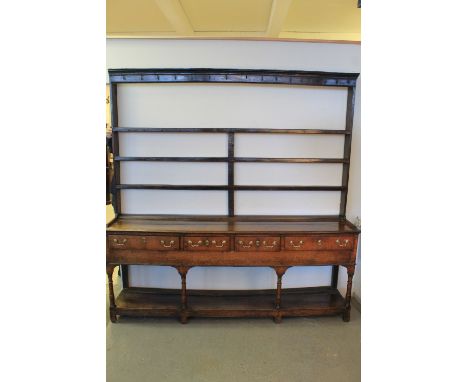 LATE 18th CENTURY WELSH OAK FOUR DRAWER POT BOARD DRESSER having three shelf open rack back over moulded edge base with four 