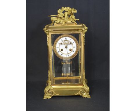 19th CENTURY ORMOLU GILT BRONZE FRENCH FOUR GLASS MANTLE CLOCK, the case with emblematic pediment surmounted by quiver of arr