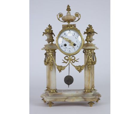 An attractive late 19th Century marble and ormolu mounted pillar Mantle Clock, by Samuel Marti, Paris, the top with an urn sh