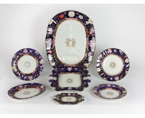 A very attractive large English Victorian Ironstone Dinner Service, by Ashworth Bros., the colourful floral decorated borders