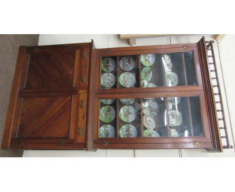 A late 19th Century tall Irish oak Bookcase, possibly by Strahan, Dublin, the galleried cornice above two glazed doors on a b