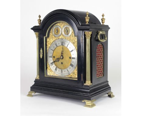A mid-19th Century large domed top Bracket Clock, the overall ebonised structure with four brass finials, flanking a domed to