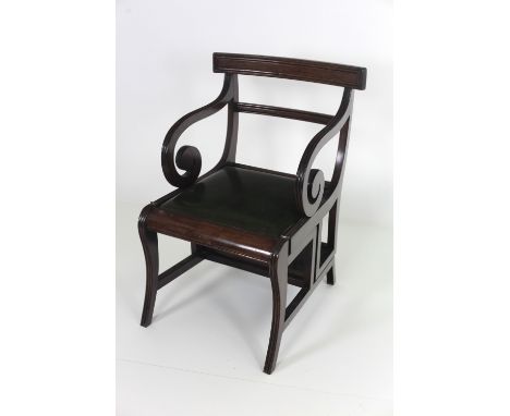 A Regency style mahogany metamorphic Library Chair / Steps, with scroll arms on front reeded sabre legs with green leather dr