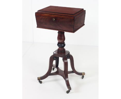 A fine quality Regency period Tea Caddy, on a turned support with platform base, and on four outsplayed and ebony strung legs