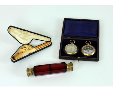 A cased pair Barometer & Compass; a crimson cutglass double ended Scent Bottle; and a carved Meerschaum type Cigarette Holder