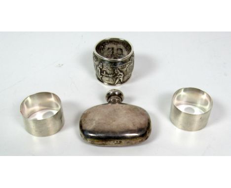 A pair of plain Birmingham silver Napkin Rings, engraved 'G' & 'J', another silver decorated and embossed Napkin Ring, with f