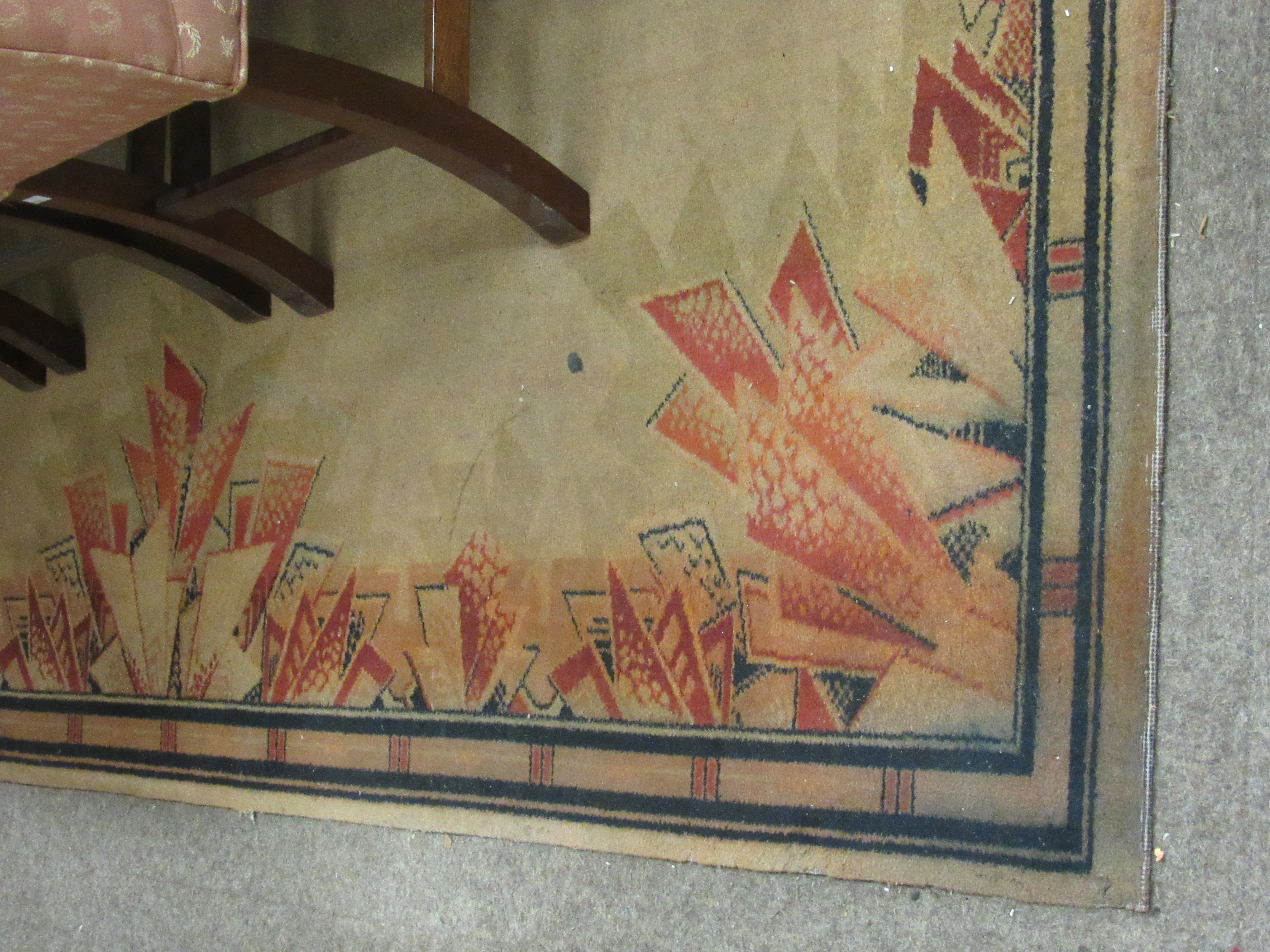 A rare pair of large Art Deco Carpets, the champagne ground centre with