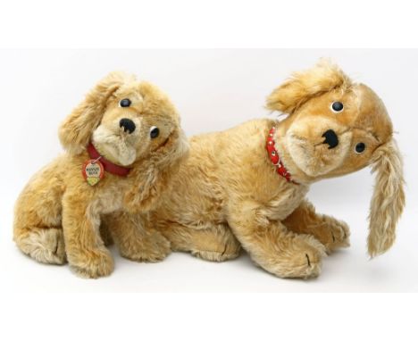 2 Sitzende Cocker-Spaniel "Revue Susi", Steiff. 1x stark bespielt und Halsband erg. 1x l. bespielt, mit K, F und S. 50er/60er