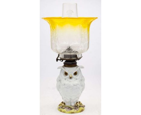 A French porcelain zoomorphic lamp: in the form of an owl on a rustic mound base with brass mounts, retailer's mark for Willi