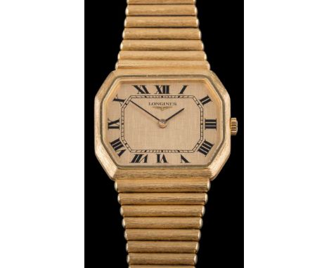 Longines. An 18ct gold 'Longines' manual wind wristwatch: the octagonal dial with Roman numerals, the seventeen jewel movemen