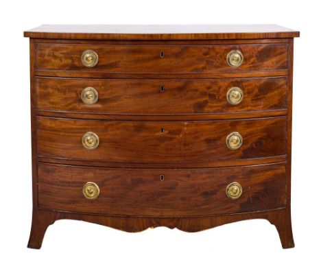 By Edwards & RobertsA late 19th Century mahogany bow-fronted chest:, containing four long graduated drawers with brass ring h